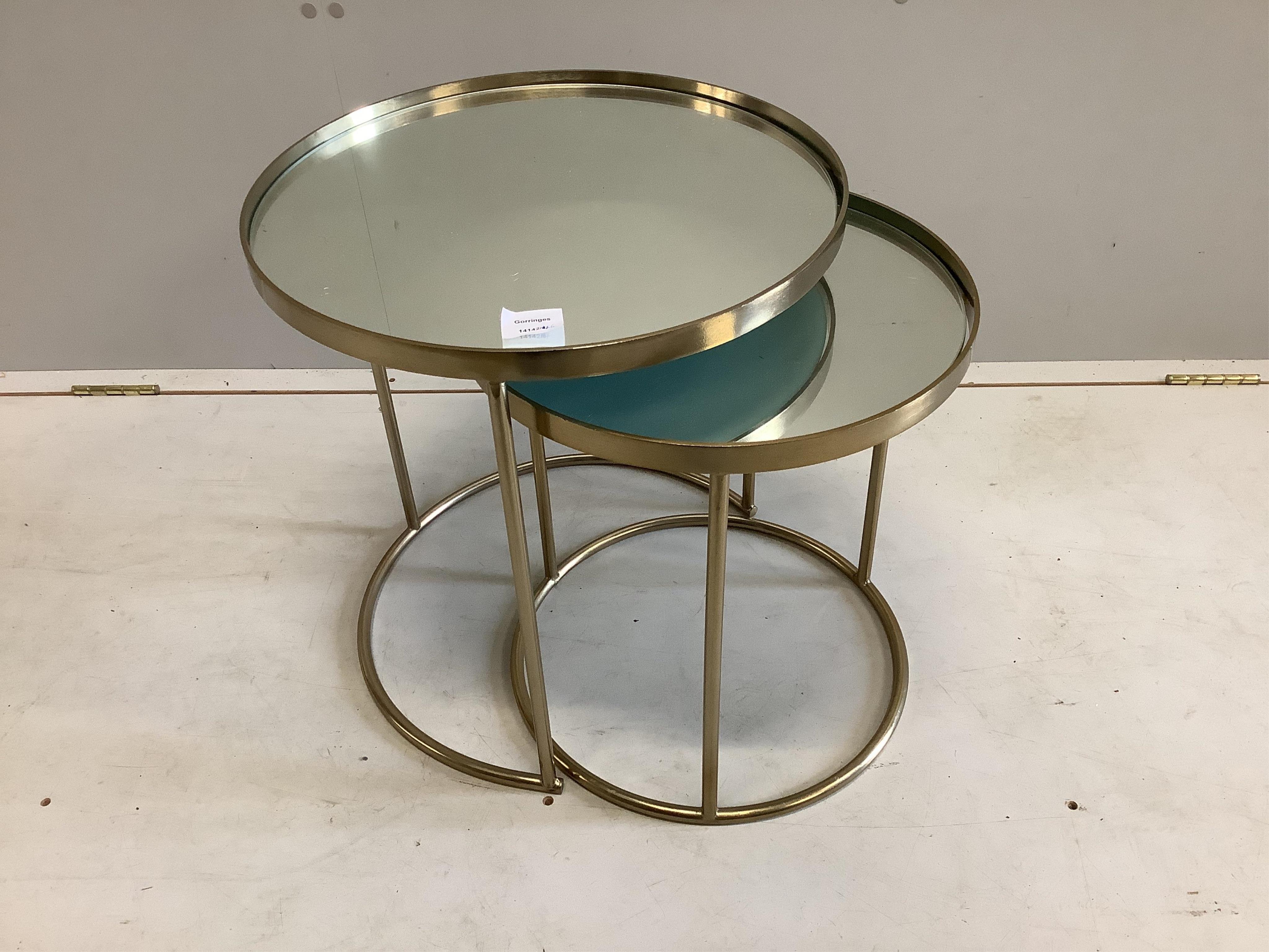 A nest of two glass and metal circular tables, diameter 44cm, height 46cm